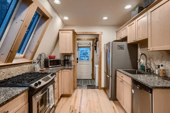 Expansive kitchen seamlessly open to the living room, creating a welcoming and interactive environment. This open-concept design enhances connectivity and flow, perfect for entertaining and family gatherings.