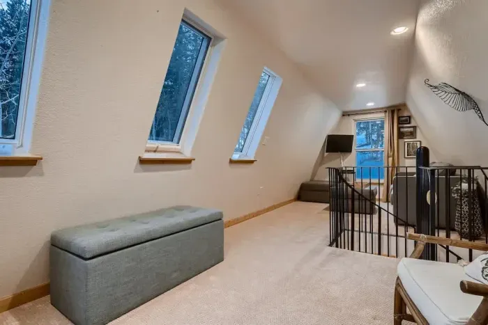 Enjoy the spacious upstairs loft, featuring a comfortable couch bed for additional sleeping space. This versatile area offers a cozy retreat with plenty of room for relaxation, perfect for guests or extra lounging.
