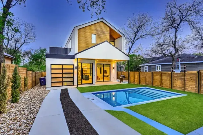 Modern home with sleek lines, large windows, and a minimalist design.