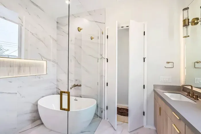 Cozy bathroom with a walk-in shower and chic, minimalist design.