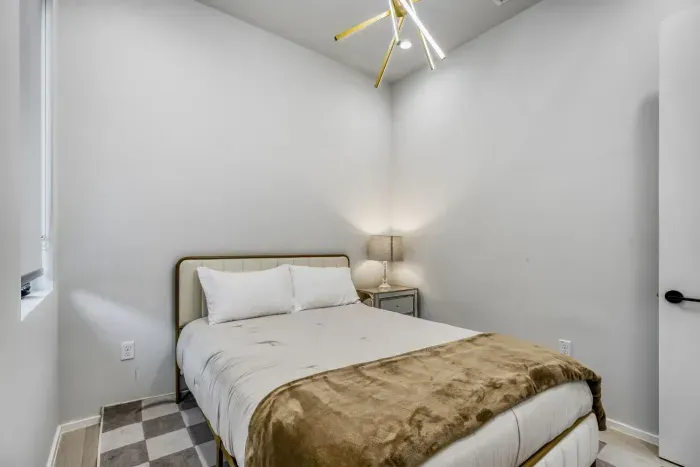 Bright and inviting bedroom designed for comfort and restful sleep.