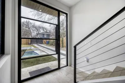 Enter the oversized modern door to the open concept floorplan