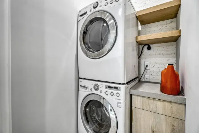Convenient laundry area with a washer and dryer, making packing a breeze.