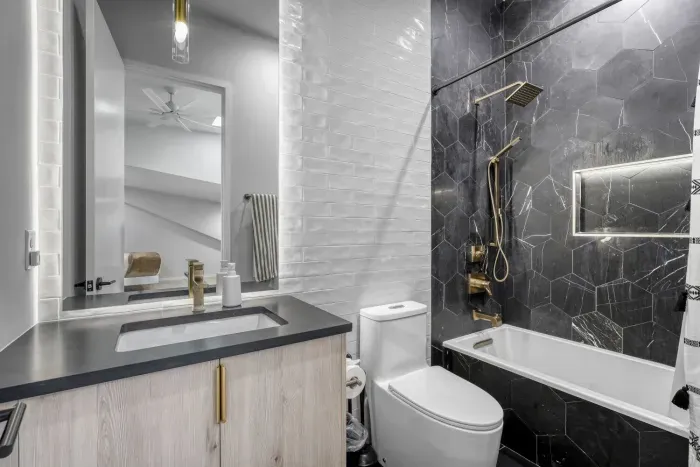 Step into a rainfall shower with endless hot water, ready to recharge you after a day of exploring.