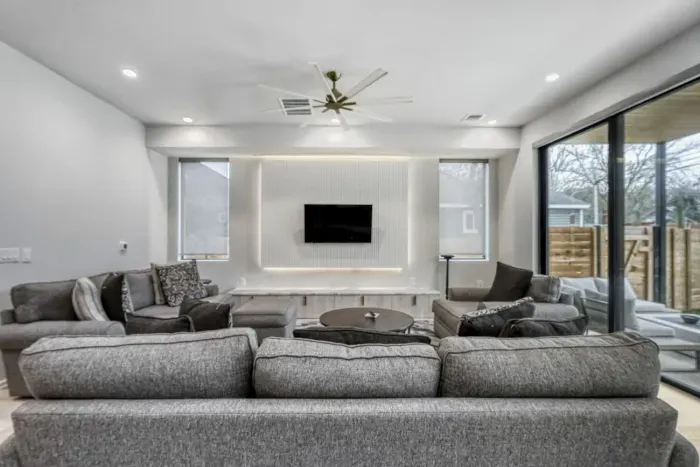 Cozy living room with plush seating and a large TV for movie nights or relaxing afternoons.