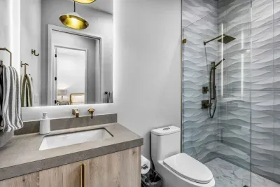 Modern bathroom with sleek fixtures, a spacious shower, and high-end amenities.