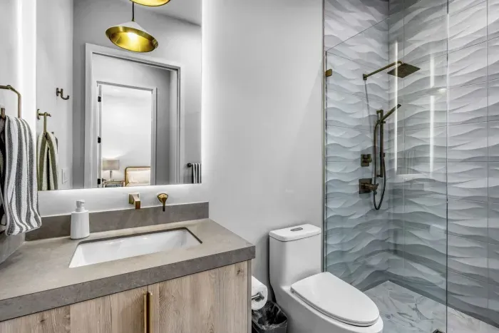 Modern bathroom with sleek fixtures, a spacious shower, and high-end amenities.