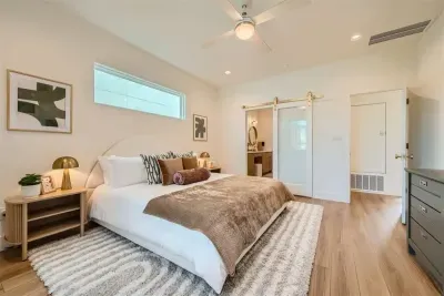 Enjoy the comfort of the primary bedroom on the main level, featuring a luxurious king-sized bed. This spacious retreat offers convenience and relaxation, with elegant furnishings and a peaceful ambiance for restful nights.