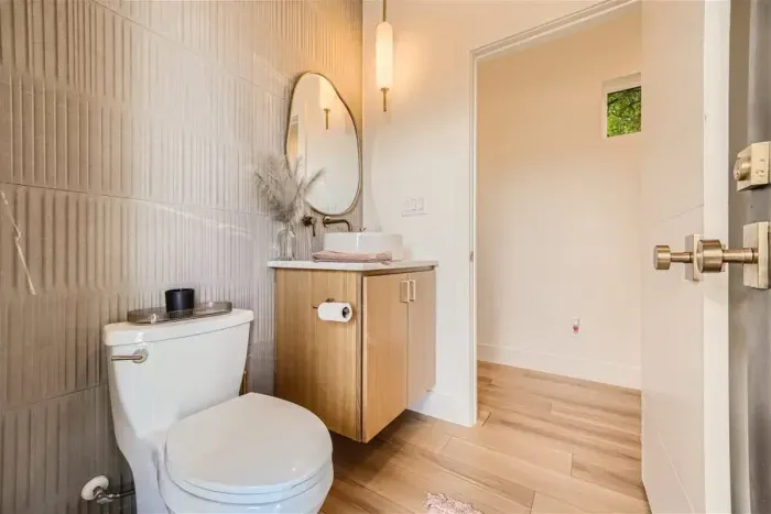 Half bath on main level with access to patio and pool area.