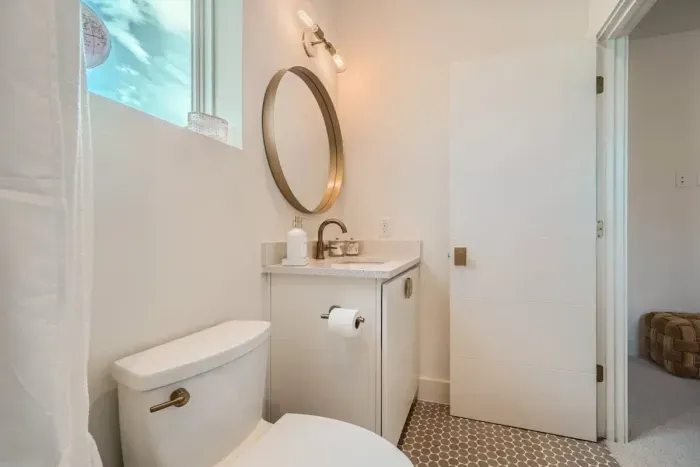 Cozy bathroom with a walk-in shower and chic, minimalist design.