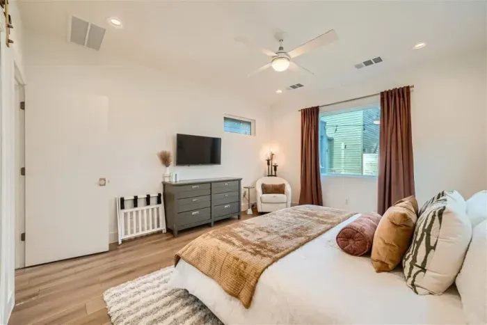 Luxurious bedroom with premium linens and a reading nook for ultimate relaxation.