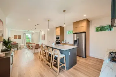 Bright, open-concept kitchen flows seamlessly into the dining area for effortless entertaining.