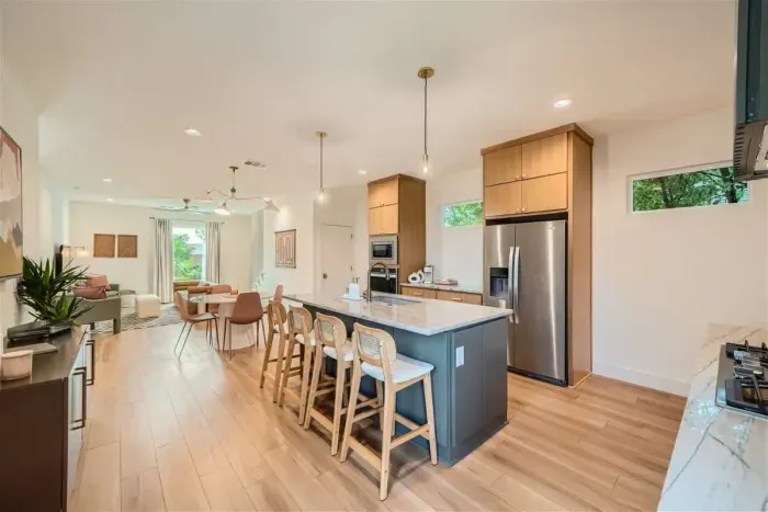 Bright, open-concept kitchen flows seamlessly into the dining area for effortless entertaining.