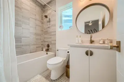Relaxing bathroom with a freestanding tub and stylish tiles for a luxurious experience.