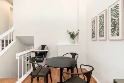 Open-concept dining room with contemporary design and natural light.