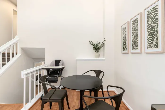 Open-concept dining room with contemporary design and natural light.