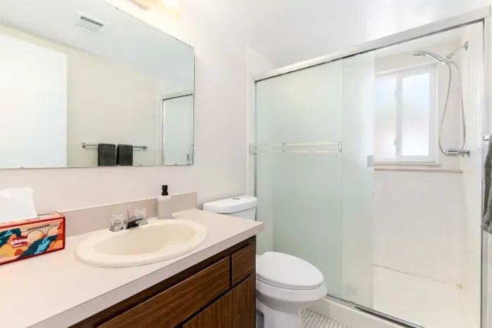 Second full bathroom with fresh, clean design and modern fixtures.