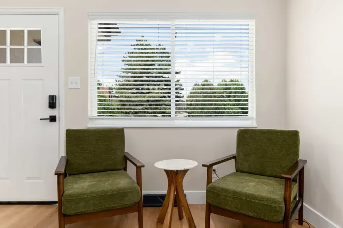 Cozy sitting area with plush seating and warm, inviting tones.