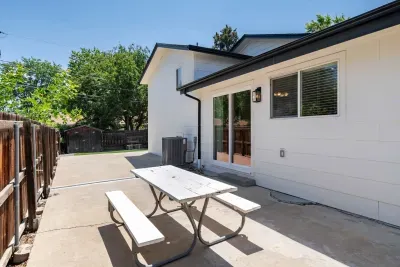 Sun-filled backyard ideal for morning coffee or BBQ gatherings.
