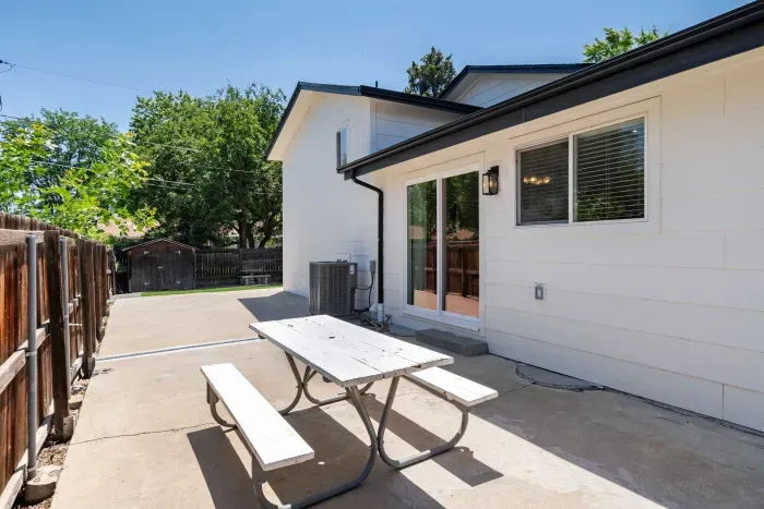 Sun-filled backyard ideal for morning coffee or BBQ gatherings.
