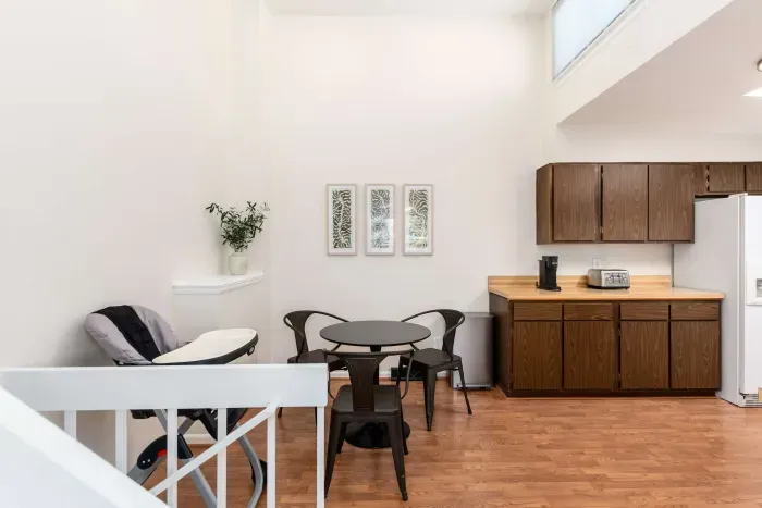 Stylish kitchen with warm wood finishes and functional layout.
