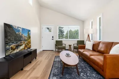 Entertainment-ready living area with smart TV and modern charm.