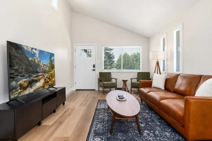 Entertainment-ready living area with smart TV and modern charm.