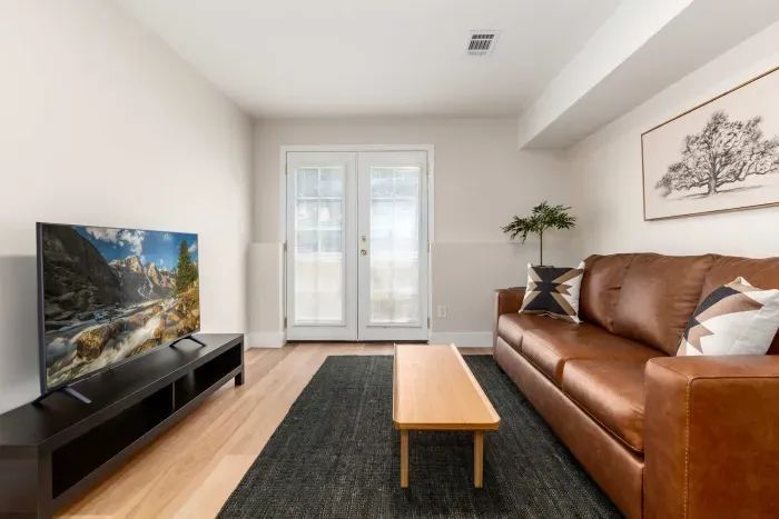 Open living area with plenty of seating and natural light for relaxation.