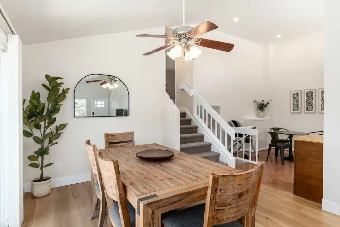 Dining space with wood furnishings and plenty of natural light.