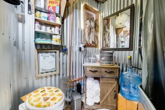 A refreshing, clean bathroom with charming decor and all the essentials.