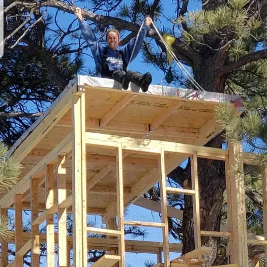 Sitting on the roof. This will be a future rooftop deck! Below me is the bedroom...