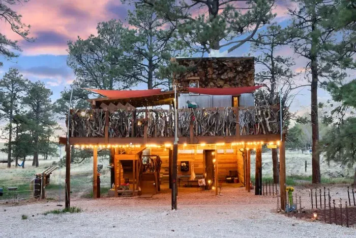 Treehouse Magic at House's High Treesort: A 300-square-foot off-grid treehouse nestled in nature, featuring an expansive 1,100-square-foot deck. Built over 4 years, this labor of love offers a serene retreat with breathtaking views and a unique, cozy