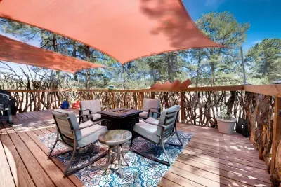Cozy propane fire pit surrounded by comfortable rocking chairs, perfect for relaxing evenings outdoors. Enjoy the warmth of the fire while rocking gently under the stars. Ideal for intimate gatherings or peaceful moments, this charming setup offers b