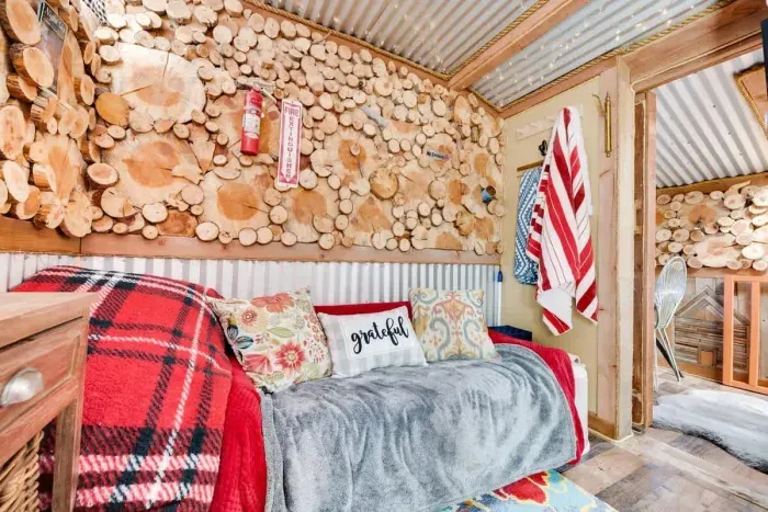 Bright and colorful upstairs bedroom filled with vibrant hues and lively decor. The playful color scheme creates an energetic and inviting atmosphere, perfect for relaxation or inspiration. With cheerful accents and stylish furnishings, this room is