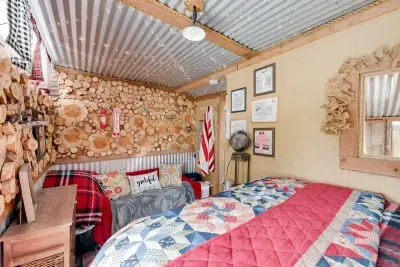 Bright and colorful upstairs bedroom filled with vibrant hues and lively decor. The playful color scheme creates an energetic and inviting atmosphere, perfect for relaxation or inspiration. With cheerful accents and stylish furnishings, this room is