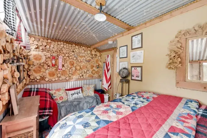 Bright and colorful upstairs bedroom filled with vibrant hues and lively decor. The playful color scheme creates an energetic and inviting atmosphere, perfect for relaxation or inspiration. With cheerful accents and stylish furnishings, this room is