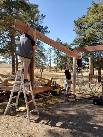 A day with friends, setting the beams for the deck.