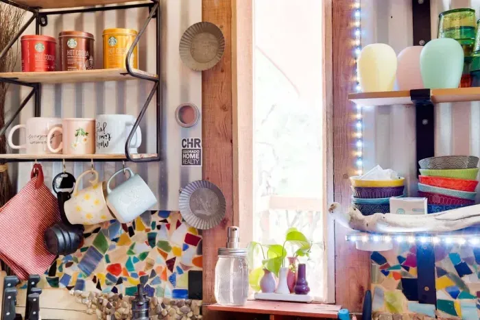 The kitchen window looks out East