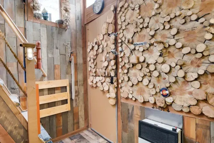 Wall detail with banana slices and a gate at the bottom of the stairs.