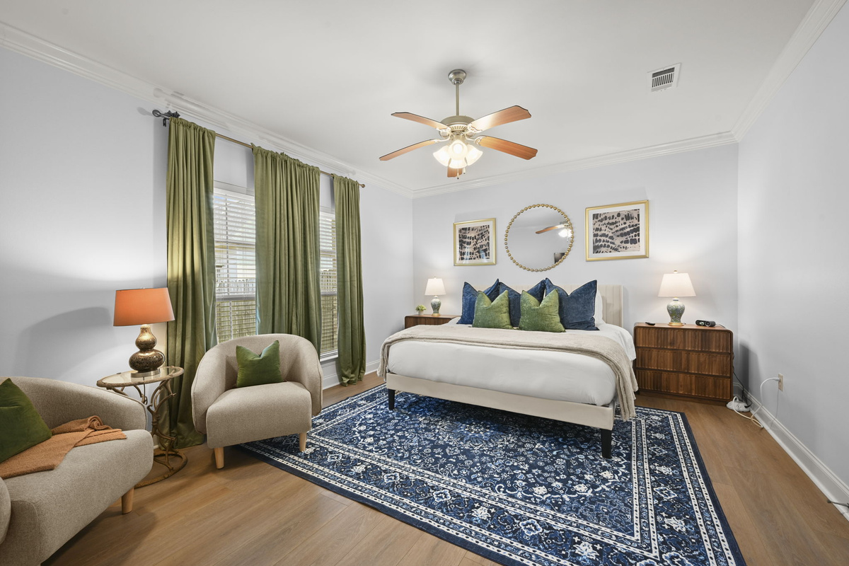 Relax in comfort with a cozy seating area, beautiful natural light, and modern touches