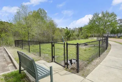 The dog park is around the corner for you pups to play.