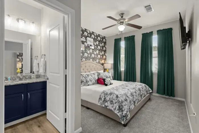 Sweet Magnolia’s attached, private, full bathroom with sliding glass shower door to the with carefully selected toiletries and hotel grade towels.