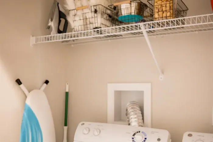 Full size washer and dryer and cleaning items are in the home.