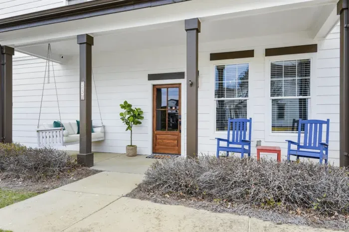 Sway in the Mississippi breeze with your choices of a fluffy oversized porch swing or colorful blue rockers.