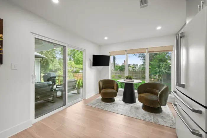 Enjoy your morning coffee in this bright breakfast nook with patio access and backyard views.