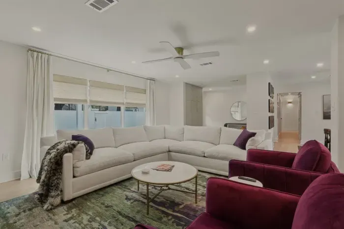Plush sectional seating, designer touches, and the perfect spot to kick back after a day of exploring 🌿