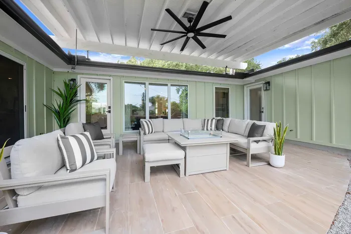 Another view of the spacious covered patio, perfect for relaxing, dining, and spending time together outdoors.