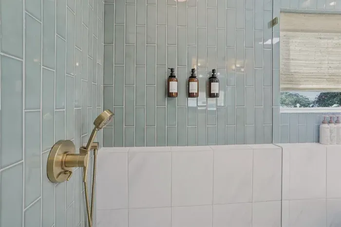 Modern details, calming tones, and rainfall shower luxury 🌿 The perfect way to unwind after a long day.