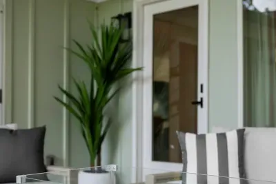 Take in the fresh air from this cozy outdoor lounge area.