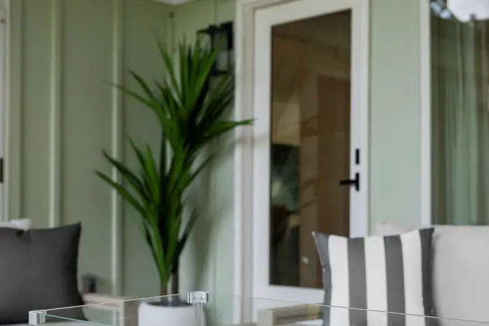 Take in the fresh air from this cozy outdoor lounge area.